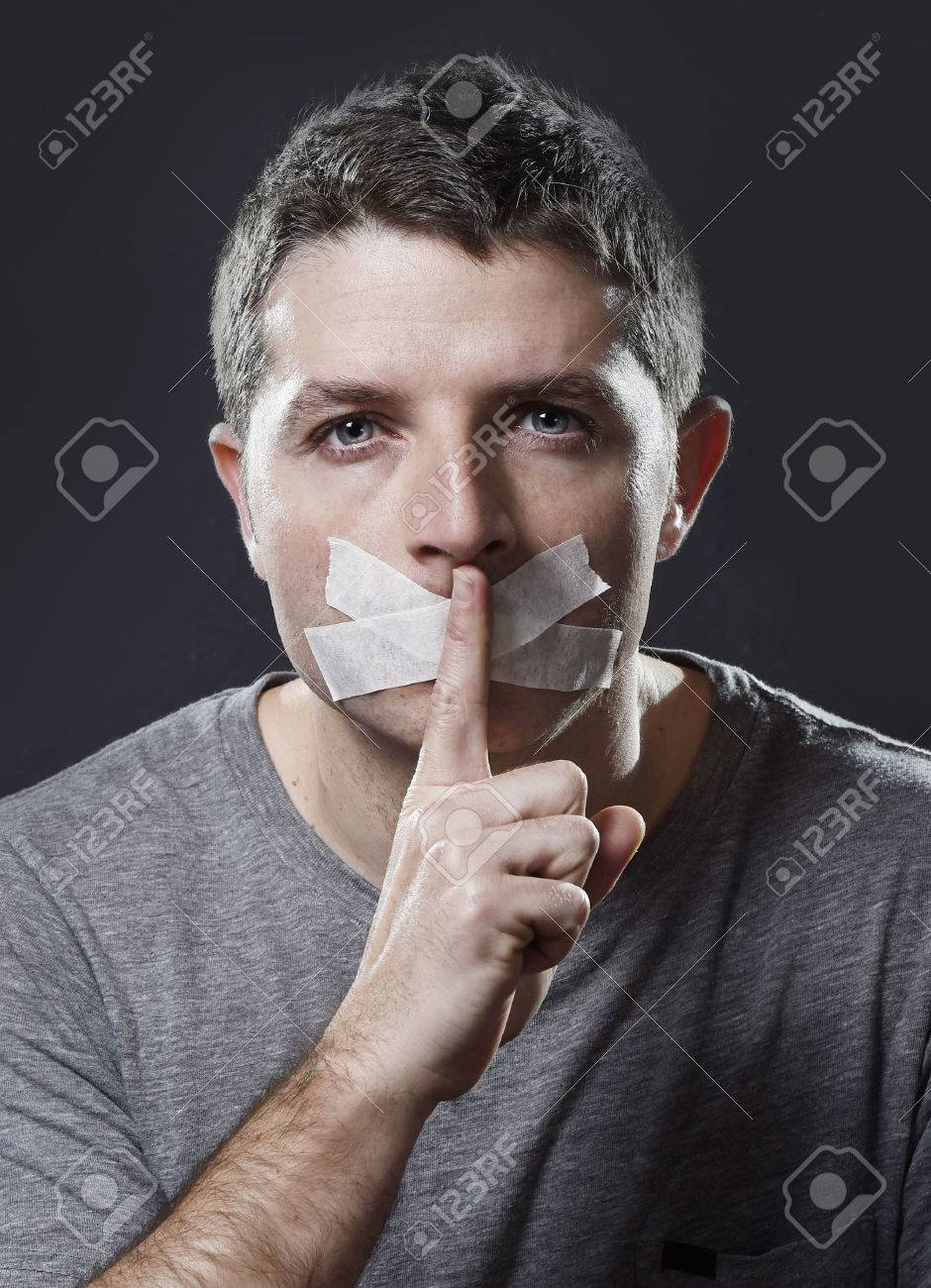 34681456-attractive-young-man-with-mouth-sealed-on-duct-tape-to-prevent-him-from-speaking-keeping-him-mute-an.jpg